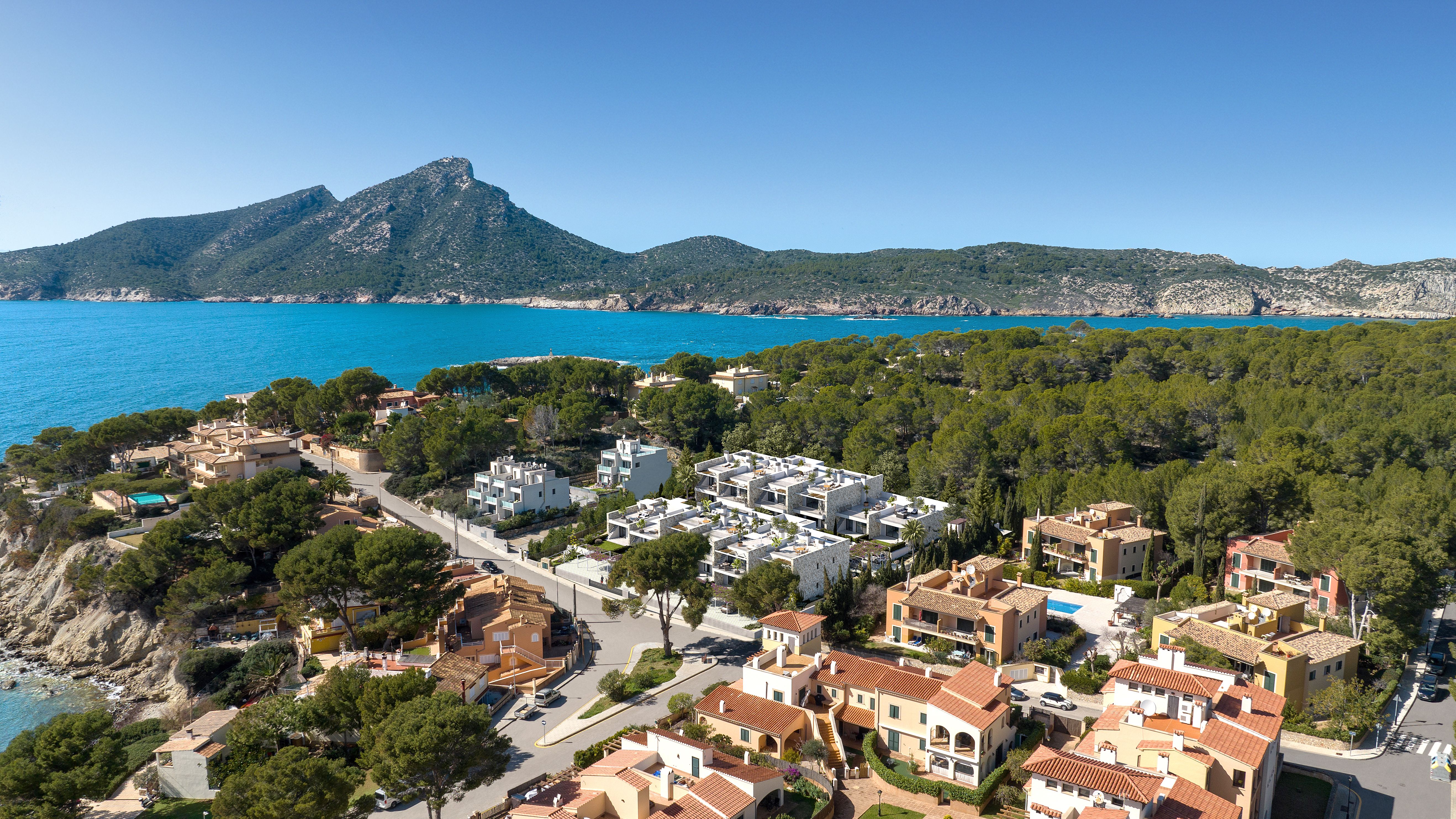 Aerial view of Eclipse apartments beside the sea and Tramuntana landscape in San Telmo, Mallorca