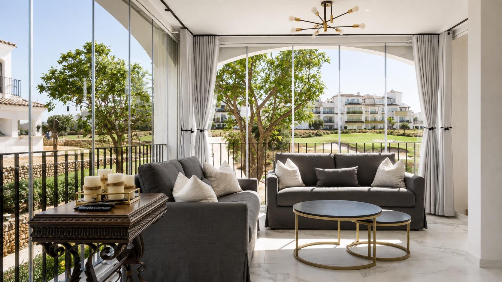 Enclosed lounge terrace with seating and golf view