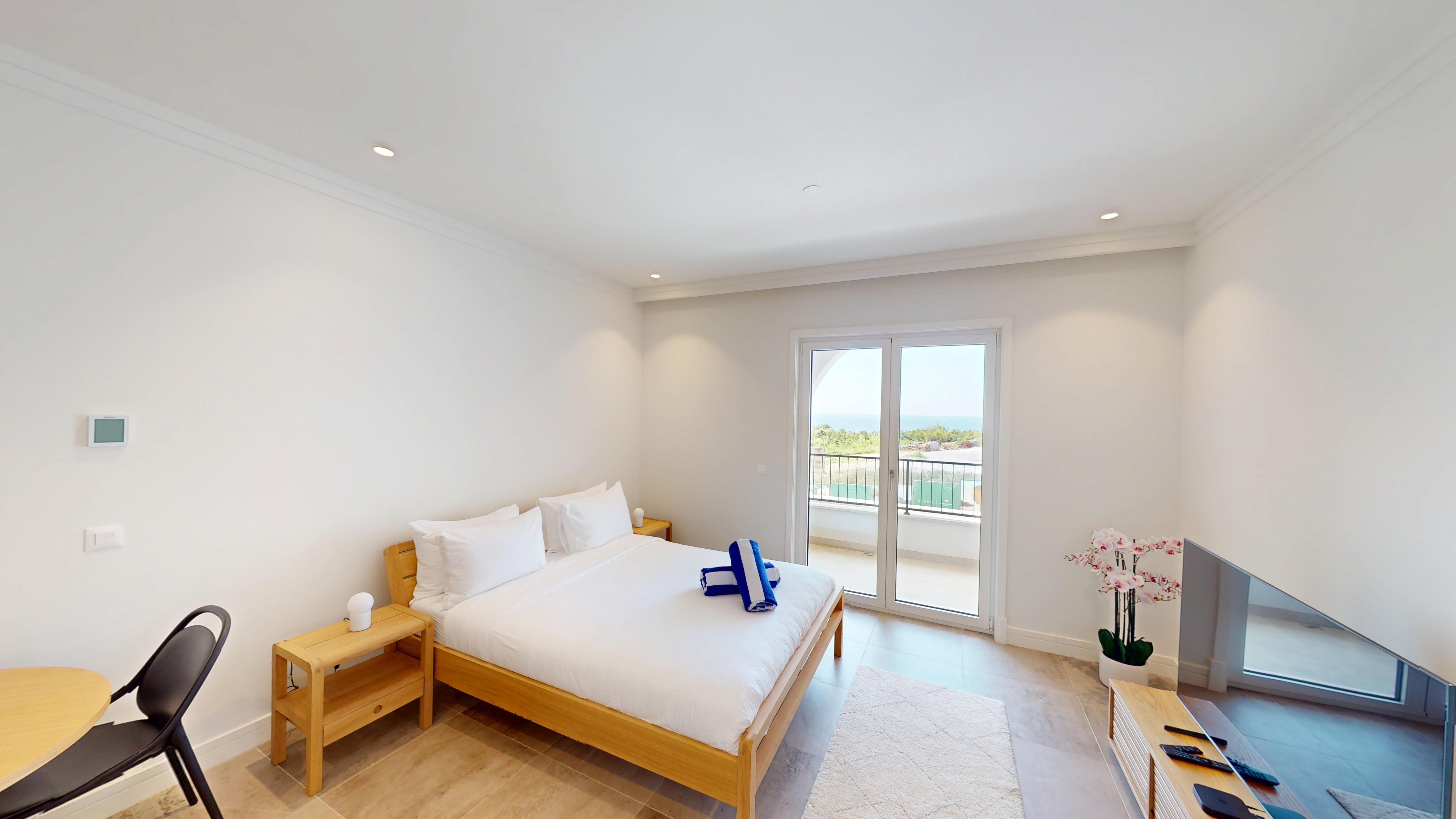 Bright studio sleeping and living space with terrace doors and sea outlook at 9212 in Centrale, Luštica Bay