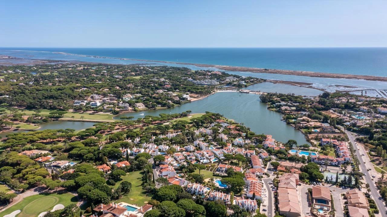 Aerial view across Quinta do Lago towards the Ria Formosa and Atlantic coast