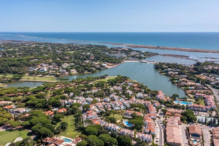 Aerial view across Quinta do Lago towards the Ria Formosa and Atlantic coast