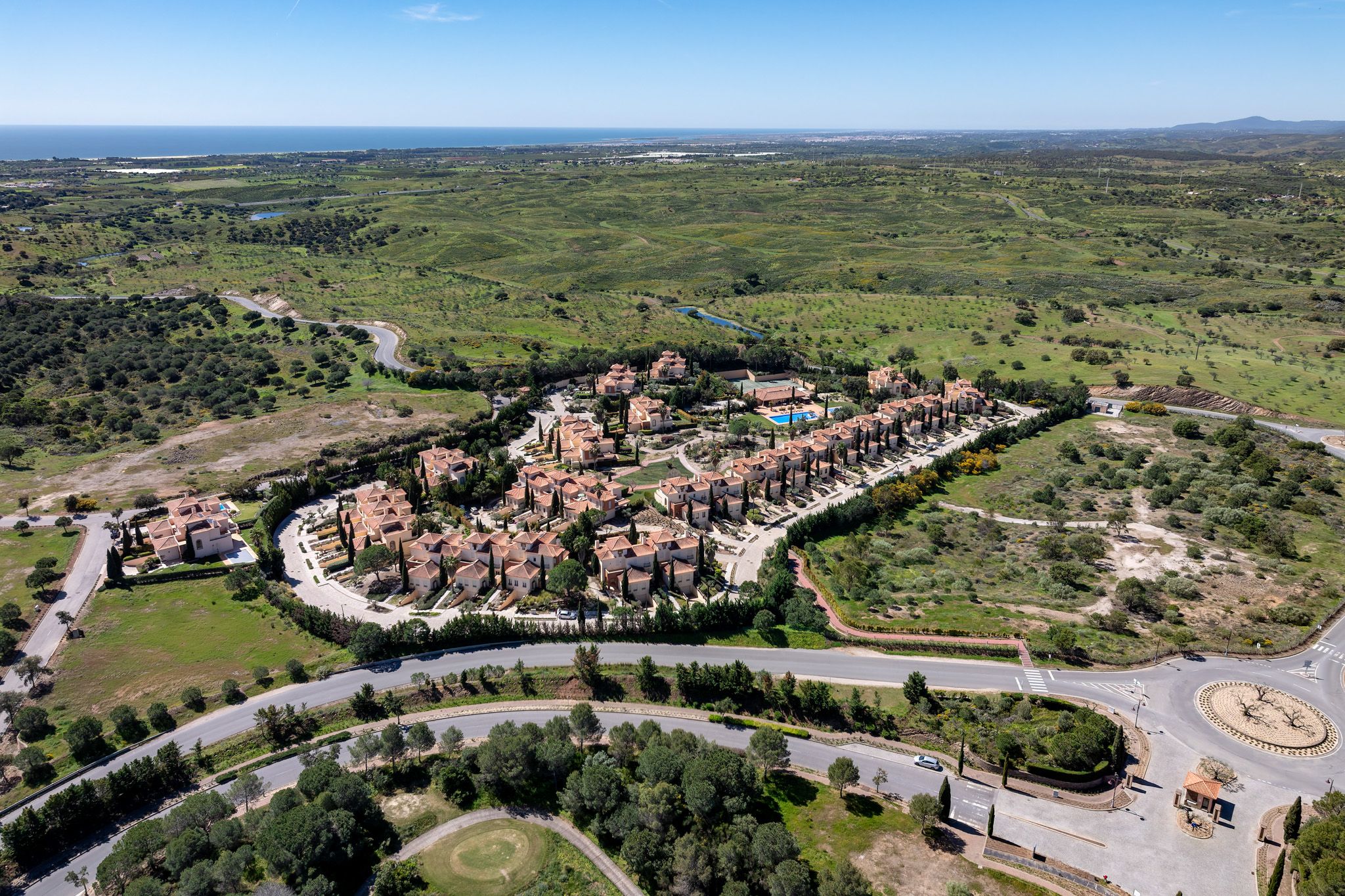 Completed Monte Rei residences in the Eastern Algarve with the coastal landscape beyond