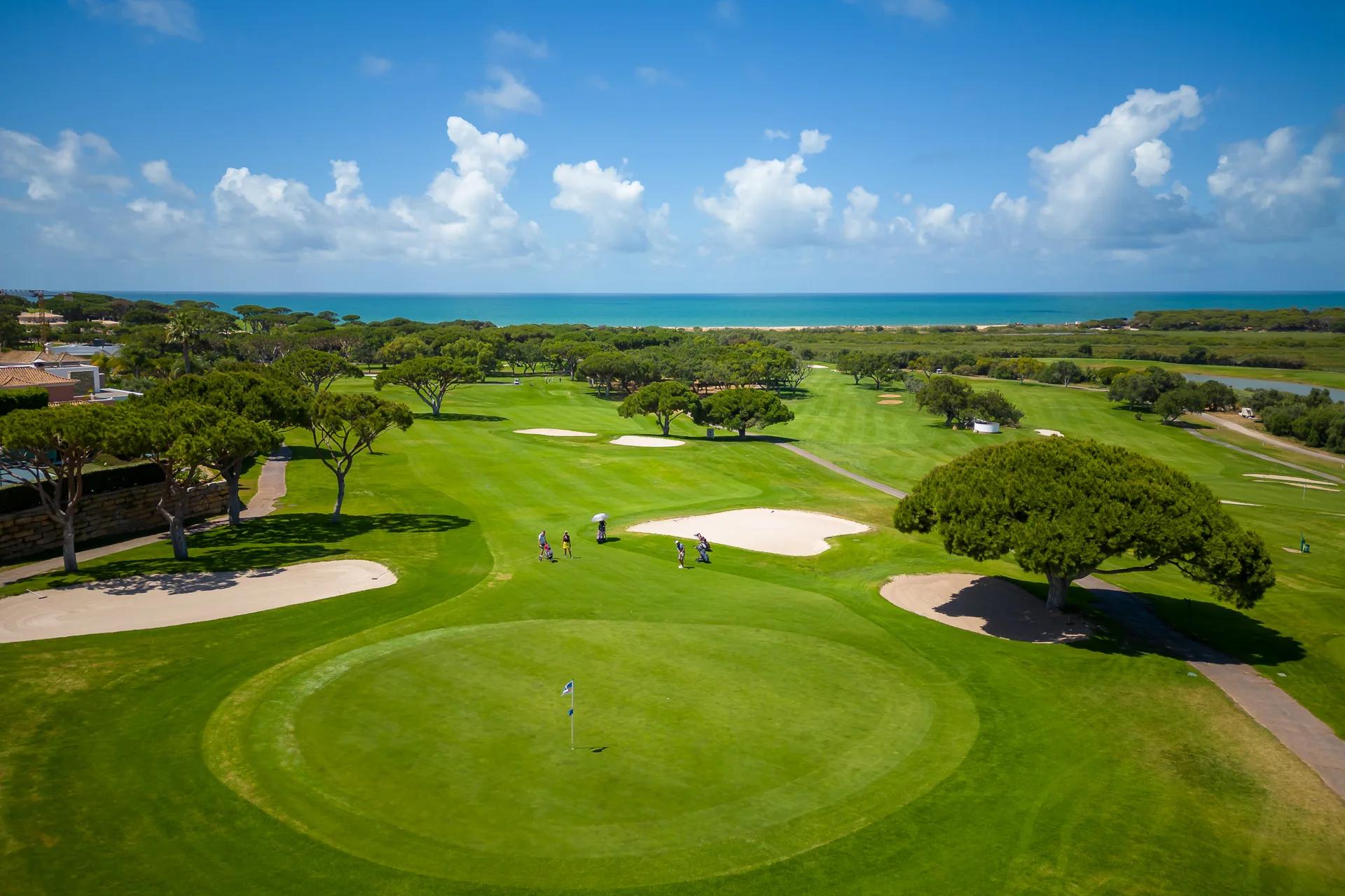 Ocean Golf Course fairways and bunkers overlooking the Atlantic at Vale do Lobo