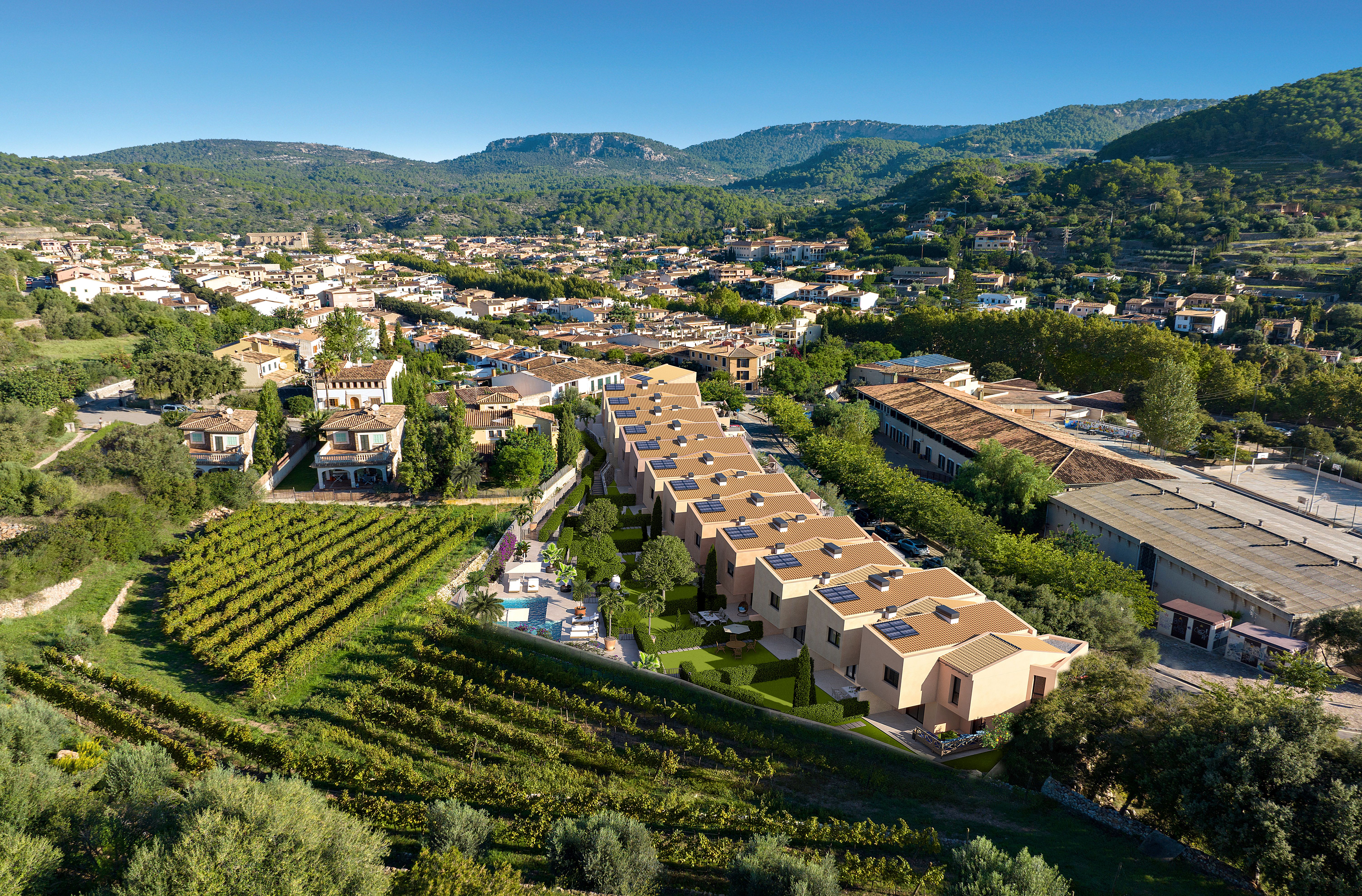 Aerial CGI or composite view of Es Voltor townhouses beside vineyards and the village of Esporles, Mallorca