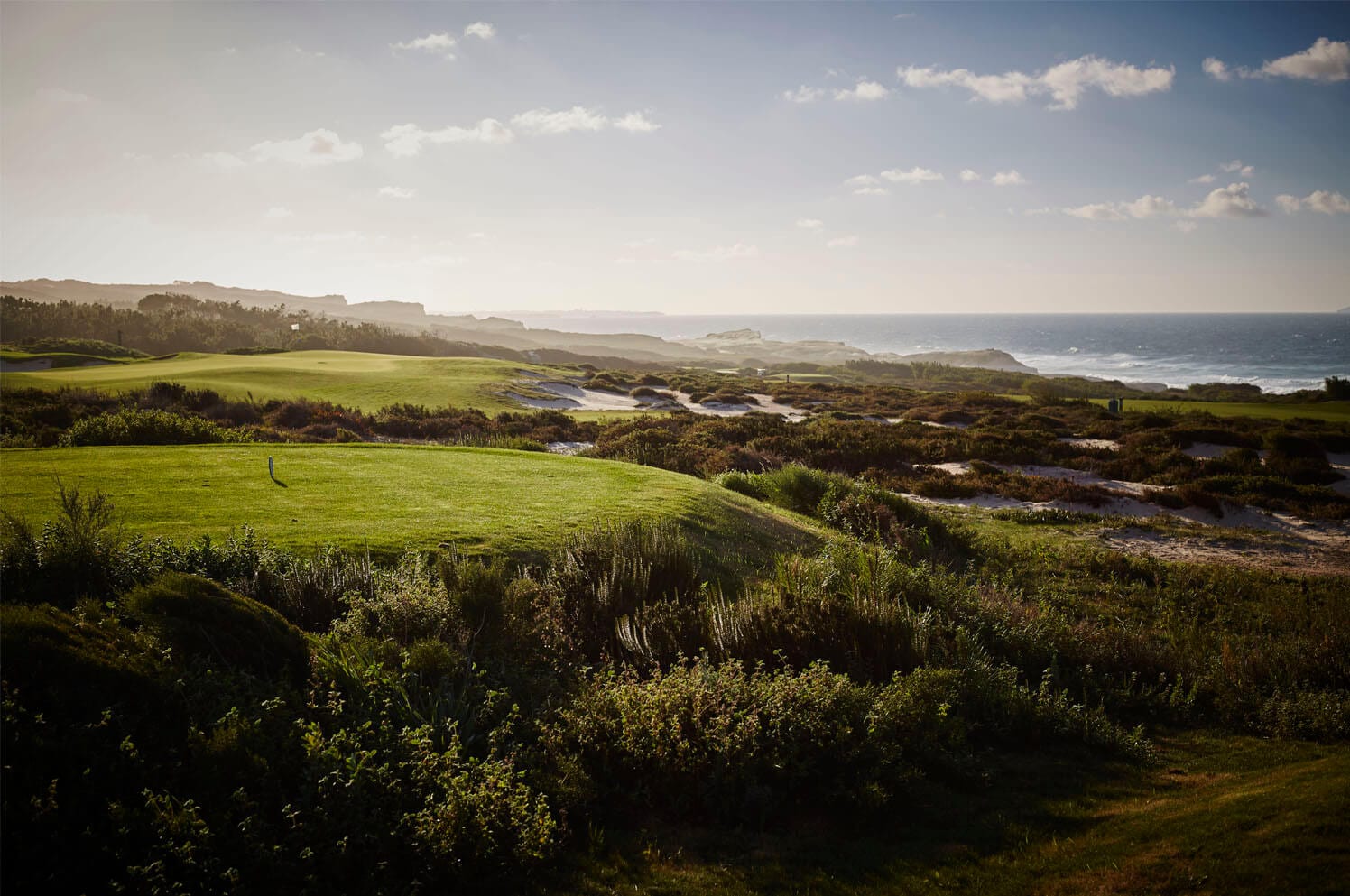Rolling fairway and coastal vegetation at West Cliffs Golf Course