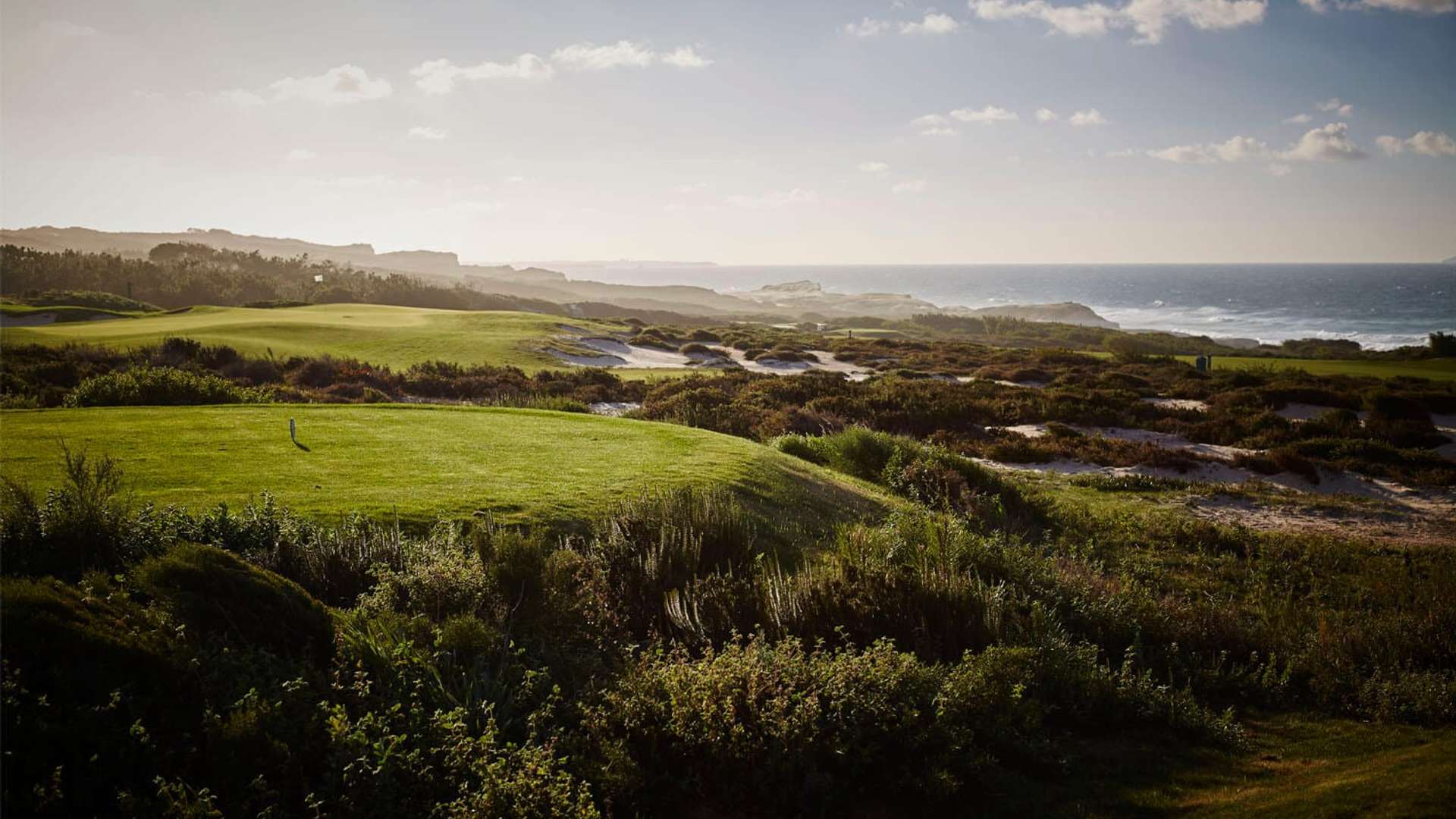 Rolling fairway and coastal vegetation at West Cliffs Golf Course