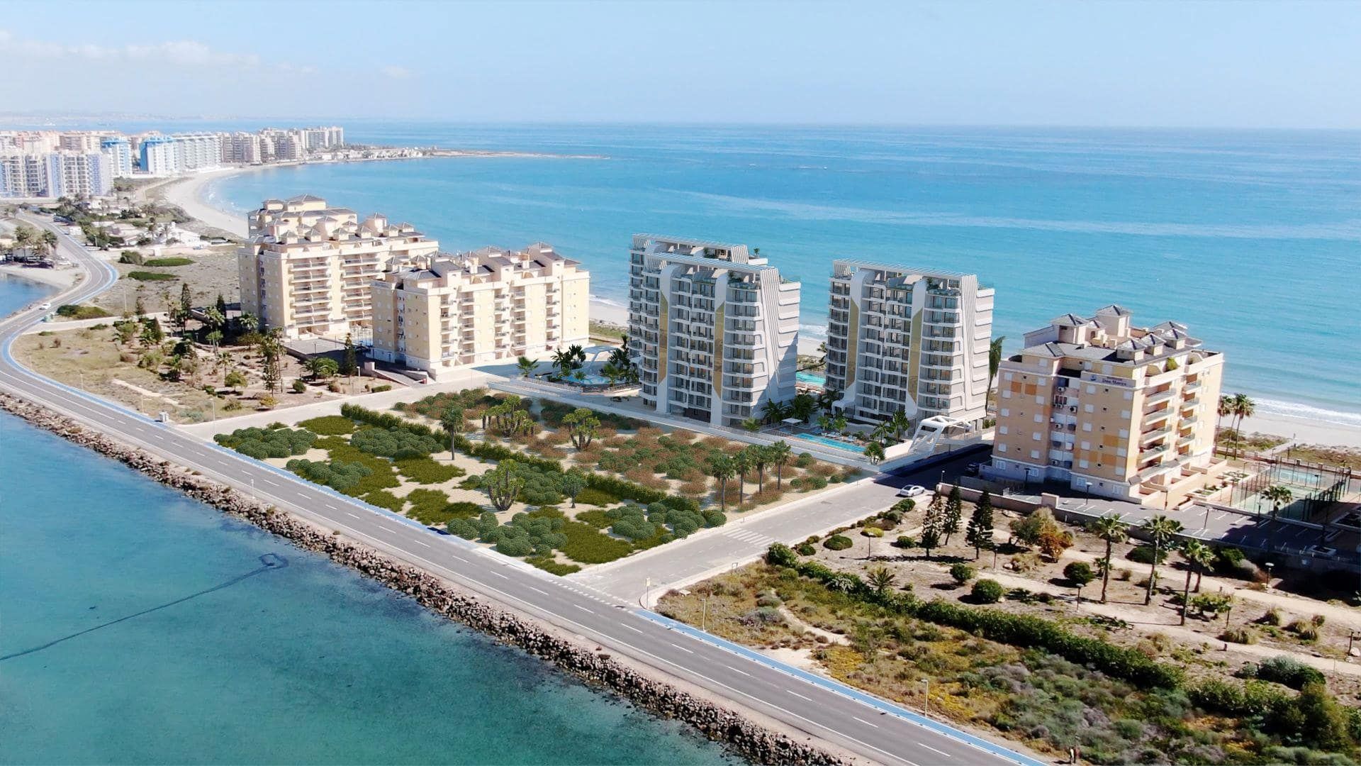 Representative aerial rendering of apartment towers between the beach and waterfront road