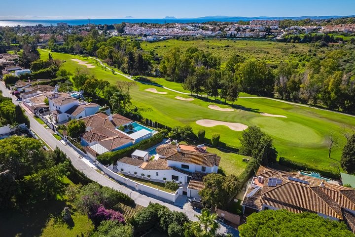 Daytime aerial of frontline golf villas beside the course in Guadalmina Alta, San Pedro de Alcántara