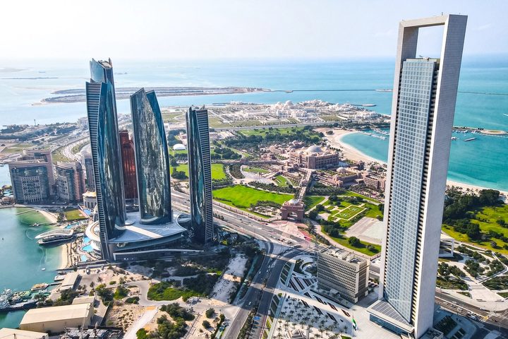 Aerial view over Abu Dhabi’s waterfront and city skyline.