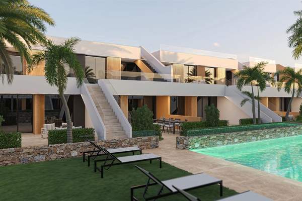 Illustrative rendering of two-level white apartment buildings beside palm trees, lawns and a communal pool