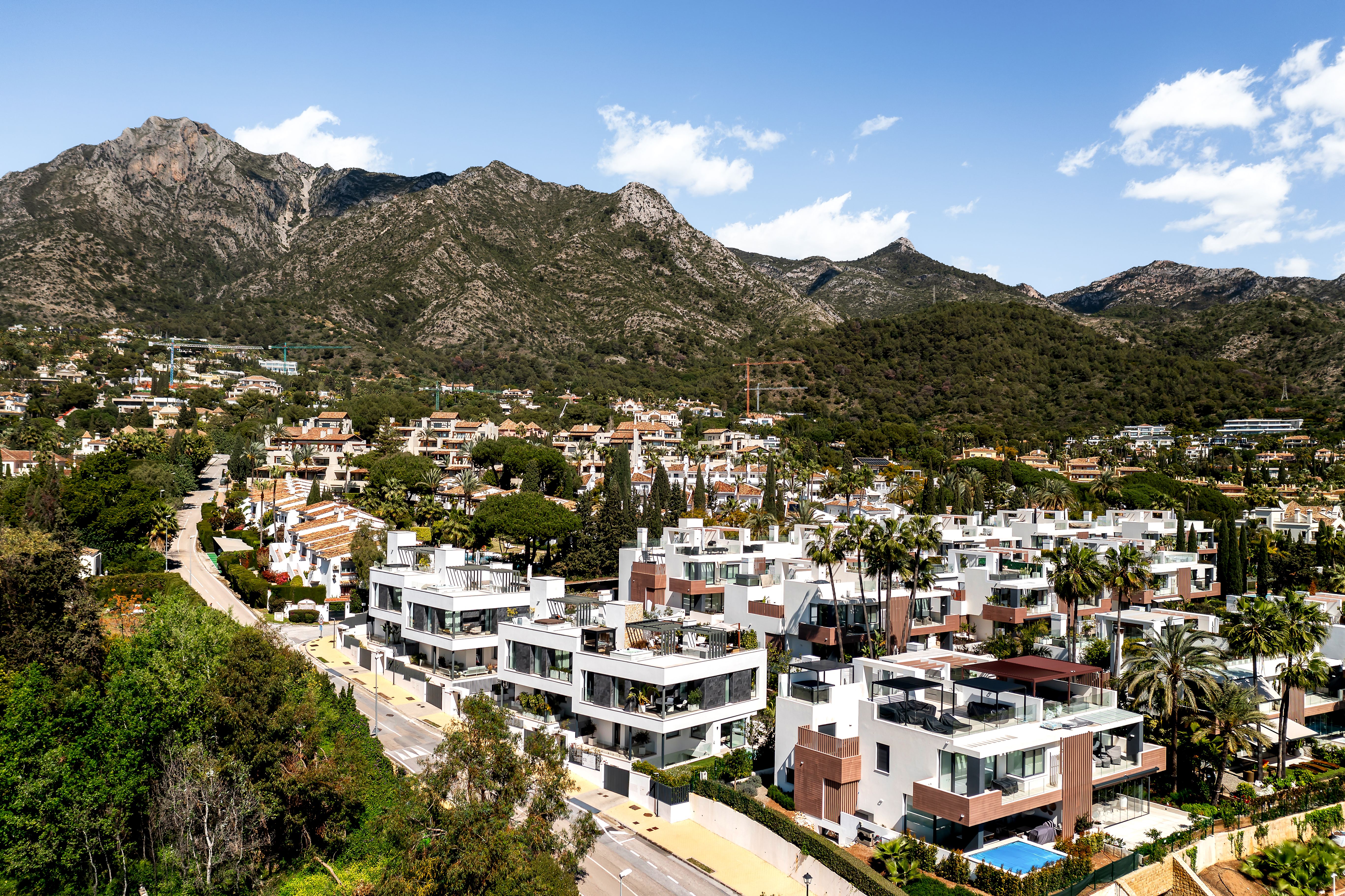 Aerial view of modern luxury villa Las Vistas 4 in Sierra Blanca, Marbella with sea views, pool and landscaped garden