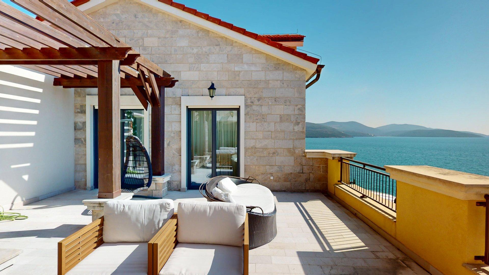 Wide terrace, stone architecture and open sea outlook in Apartment C806/C807 at Marina Village, Lustica Bay