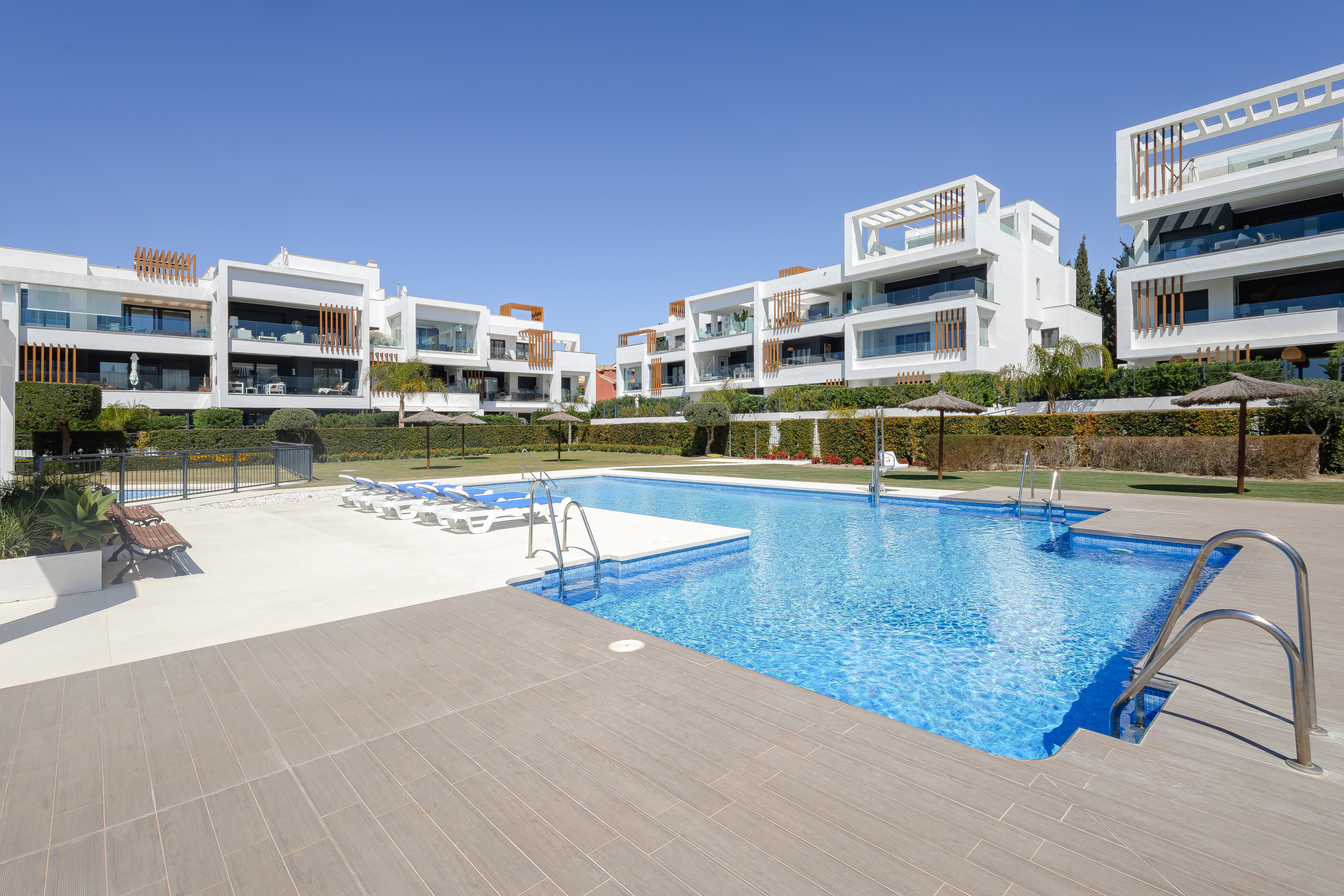 Communal pool and residential grounds at Miradores del Sol