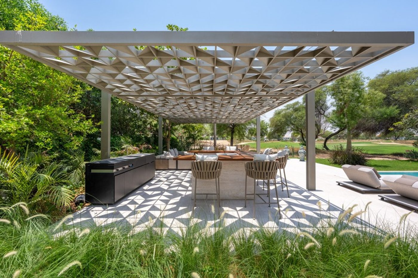Shaded outdoor dining terrace at a Redwood Avenue villa in Jumeirah Golf Estates, Dubai