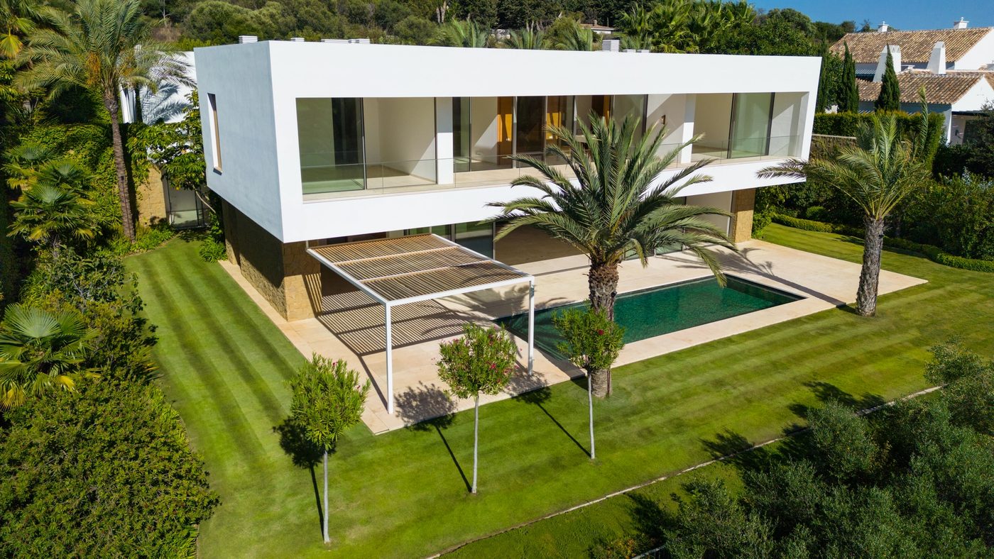 Aerial view of Golfside Villa 6 at Finca Cortesin with its pool and surrounding landscape
