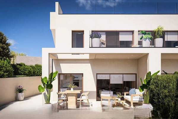 Representative daylight rendering of a white two-storey attached home with a furnished rear patio and planting