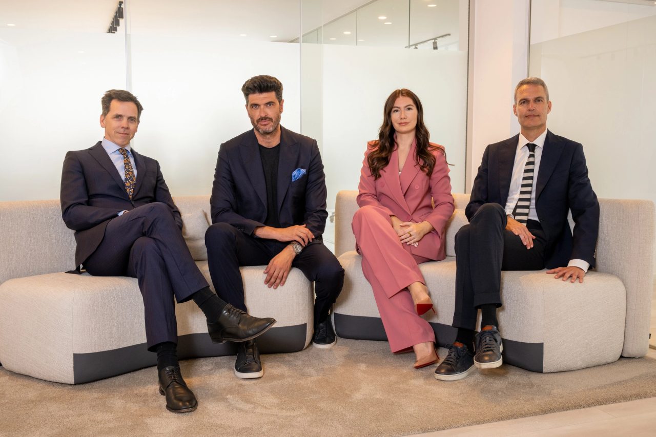 The Franke & de la Fuente team seated together in their office