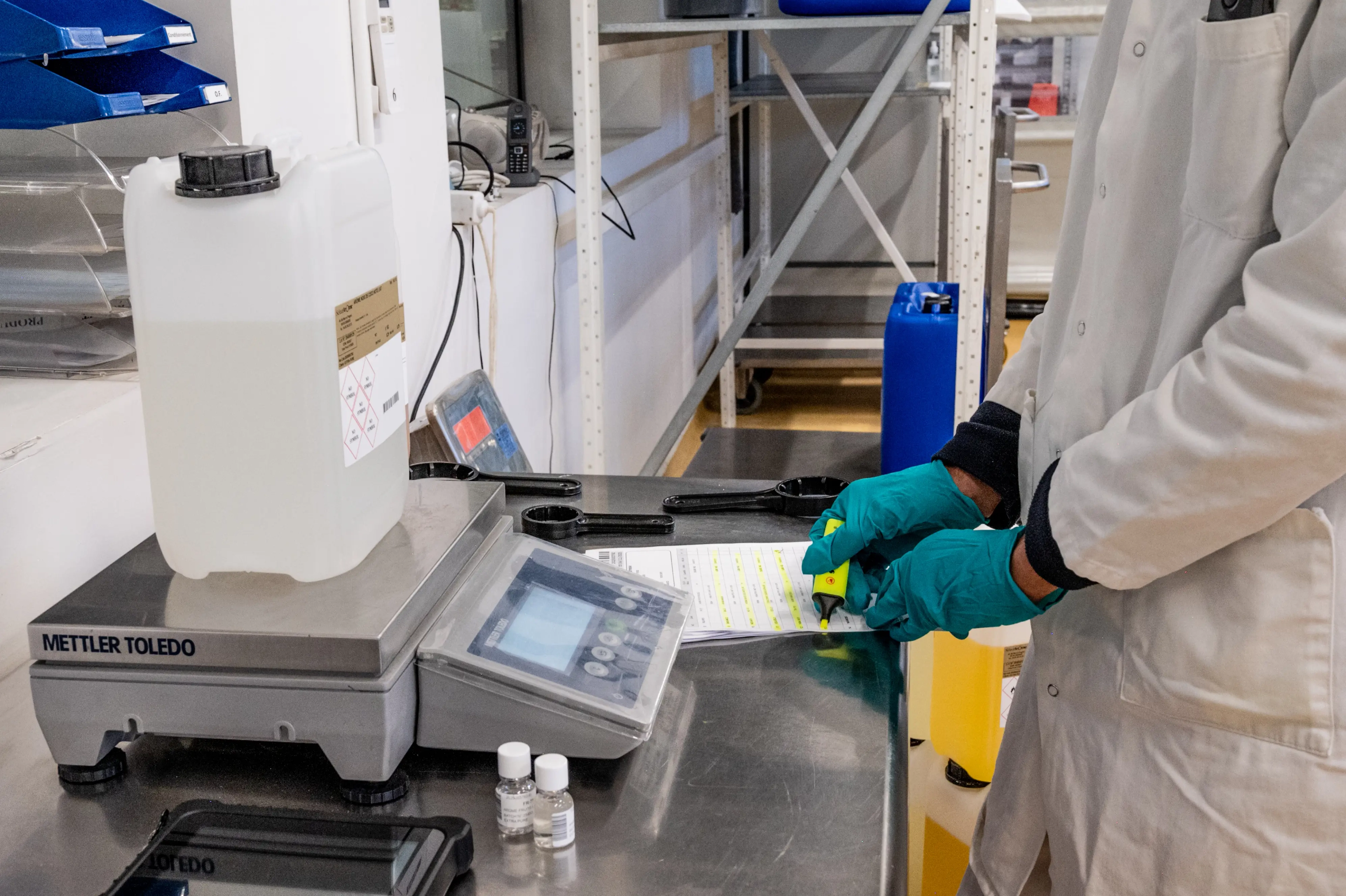 Person checking a container for quality and compliance with regulations
