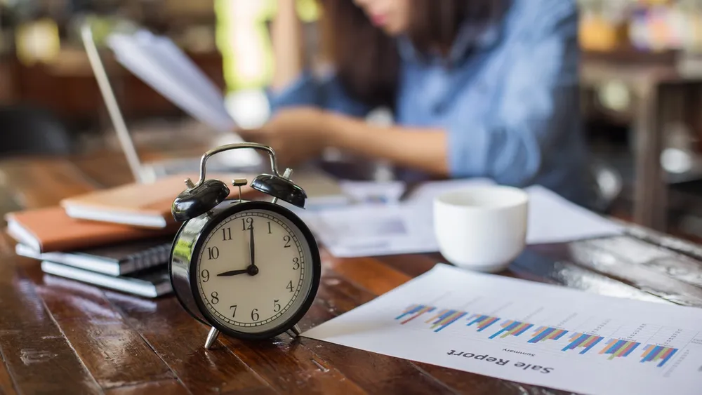 Young woman sitting in a cafe with her laptop, Stressful for work