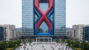 A wide-angle view of a large corporate bank headquarters with a prominent red and blue architectural design element, situated in a busy city square.