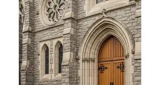 A stone building with religious architectural details and a large wooden door, symbolizing institutional heritage and legal accountability.