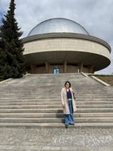 The artist on the approach steps to the entrance of the planetarium.