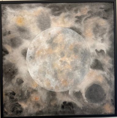 A full moon in grey and off-white with soft rust-coloured marks, in a black frame.