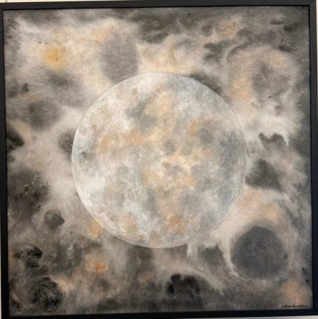 A full moon in grey and off-white with soft rust-coloured marks, in a black frame.