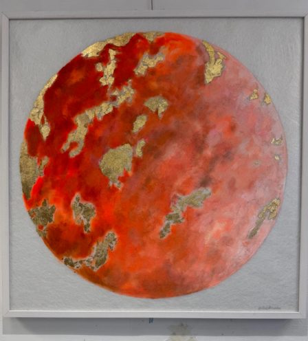 A red planet filling the whole surface, its continents in gold-coloured metal leaf, on a grey ground.