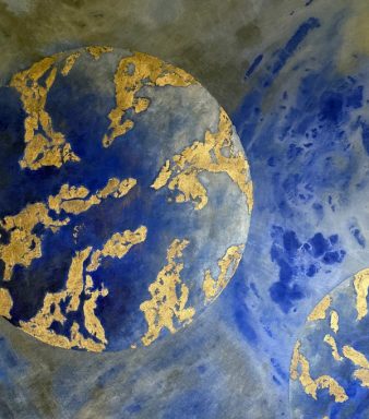 Two planets in blue and gold, one large and cropped, the other small in the corner.