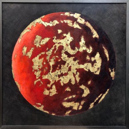 A warm planet with soft transitions and patches of gold.