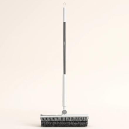 White and gray crevice brush with long handle