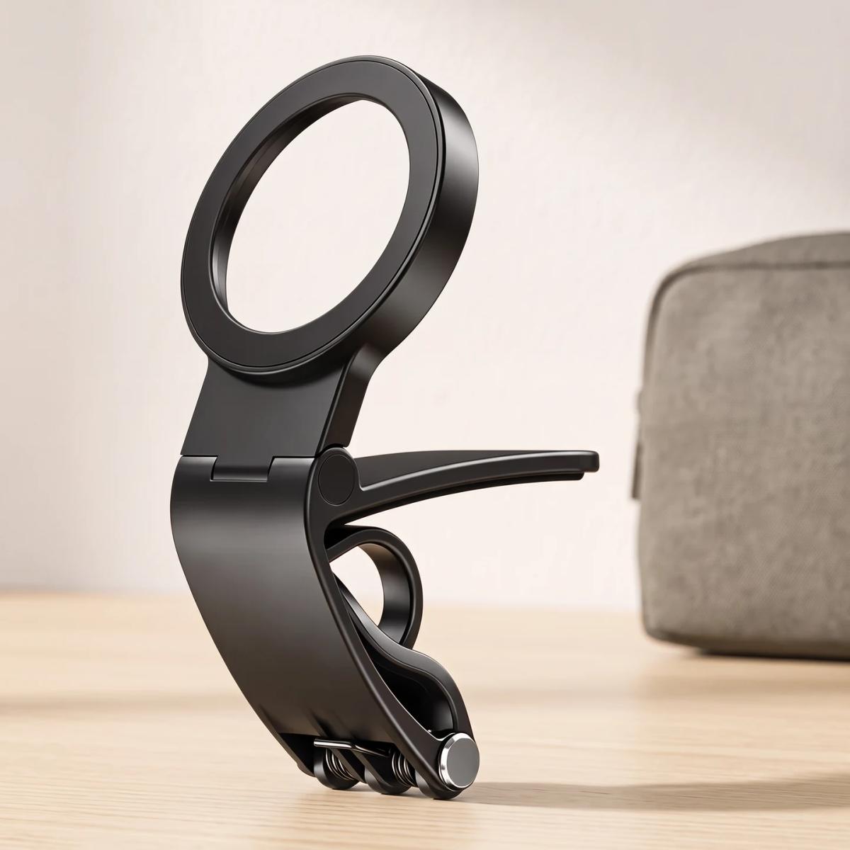 Uninstalled black ring, hinge and clamp holder beside a pouch; props are not included