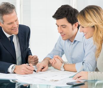 Clients discussing VA Loan with mortgage specialist.