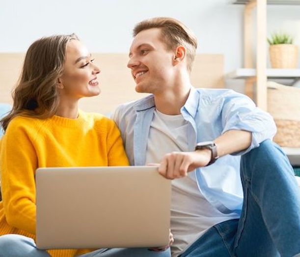 Couple creating to-do list for a smooth moving process.