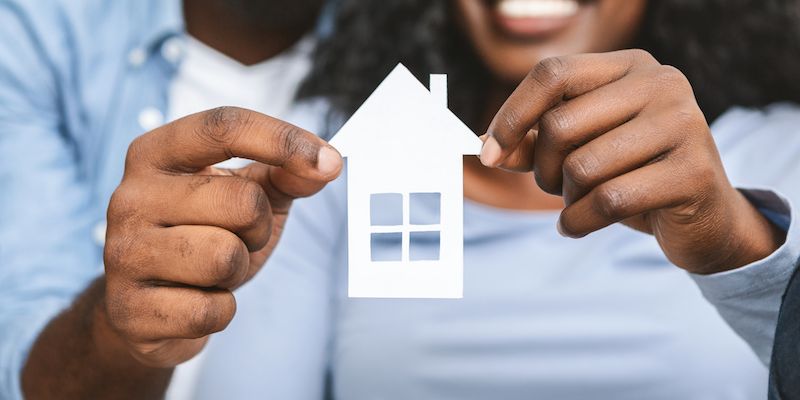 Couple holding VA home loan concept.