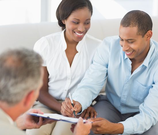 VA Loan specialist handling document to homebuyers.