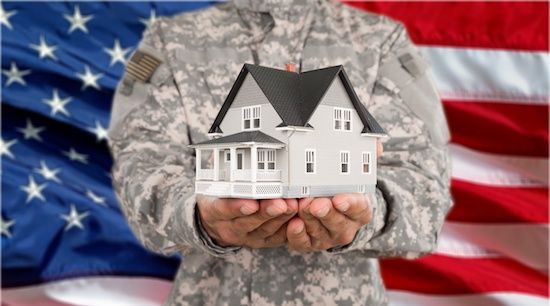 Military holding VA Home Loan concept in hand.