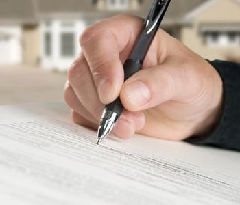 Signing title insurance document.