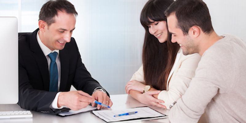 Couple signing VA loan documents.