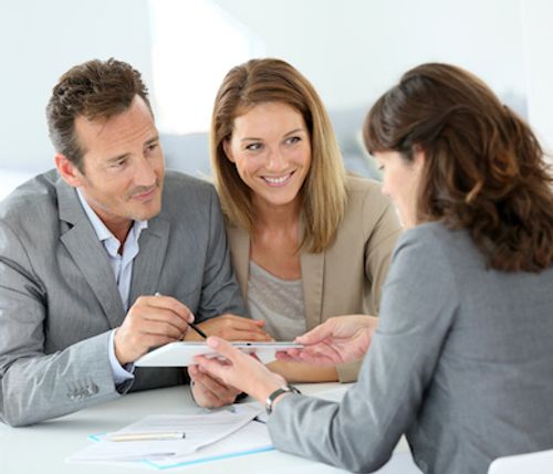 Couple talking to VA Loan specialist.