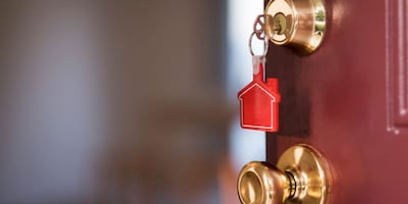 Opening door with house keys.