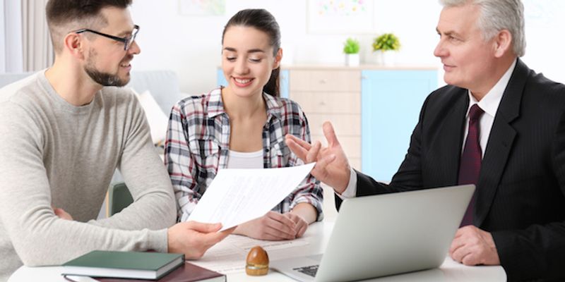 Couple discussing mortgage with a VA lender in Arizona.