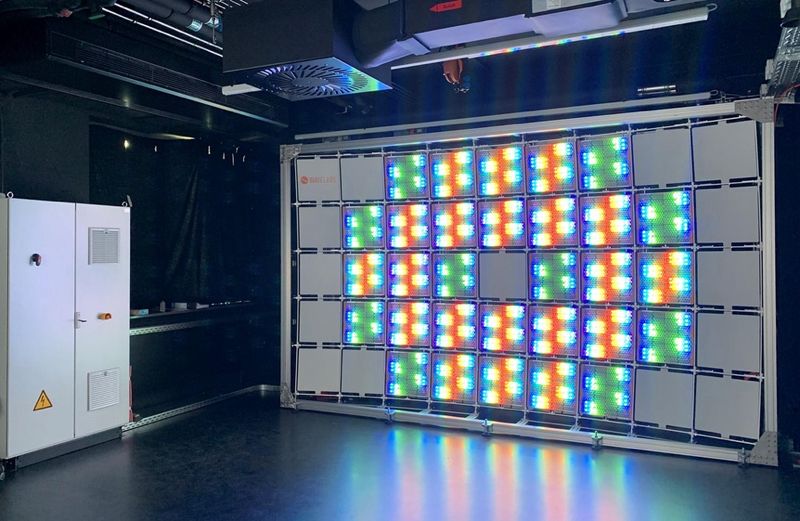 LED display panels undergoing 72-hour aging test in factory racks