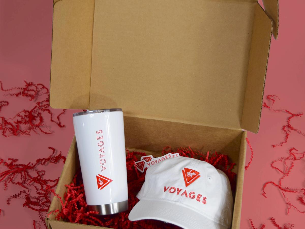 Custom branded gift kit with premium drinkware and apparel in a packed box.