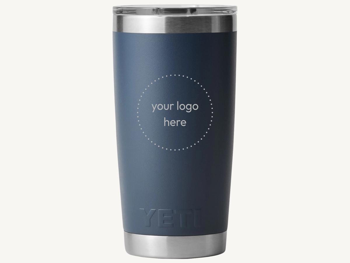 Branded drinkware and cozy apparel arranged as holiday gifts for employees.