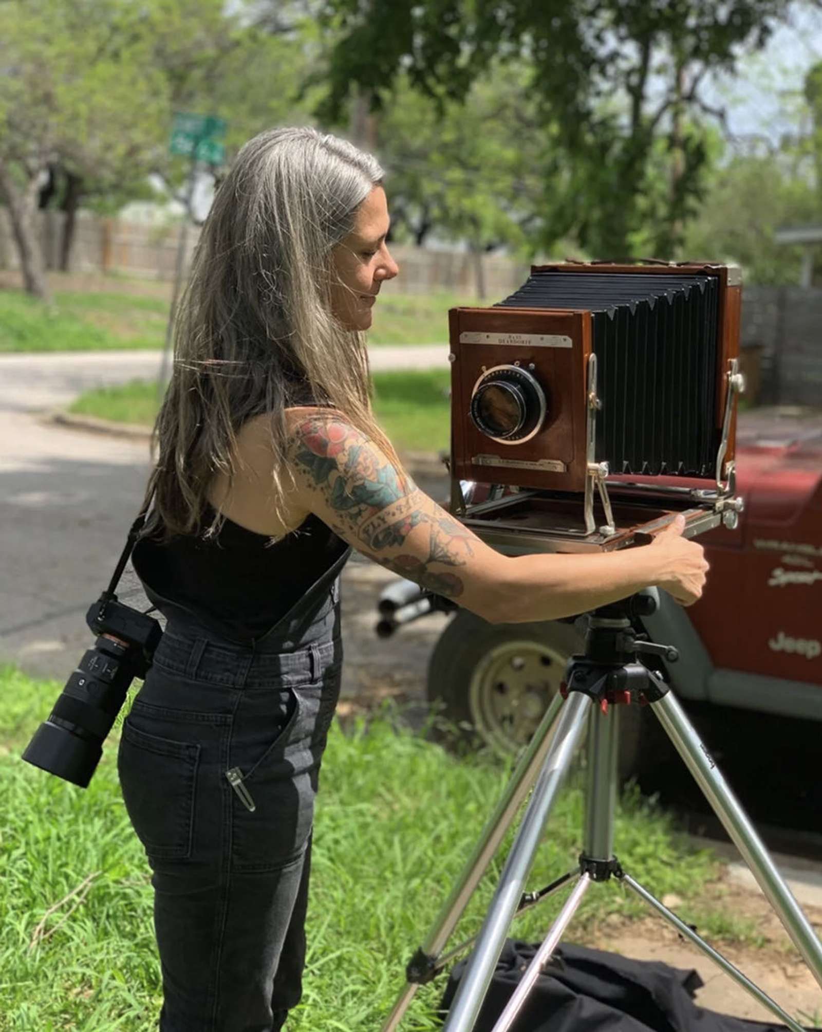a photo of a woman with a large format camera