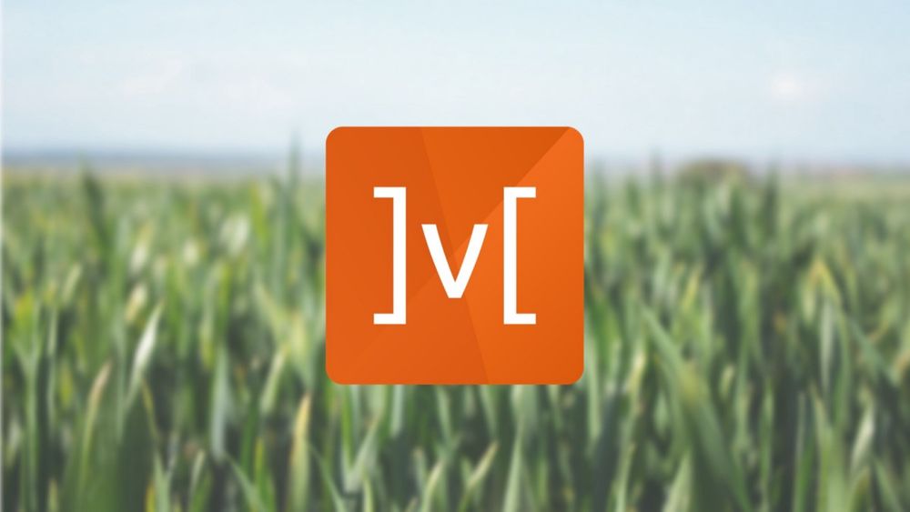 The MobX logo overlaid on a field of green grass