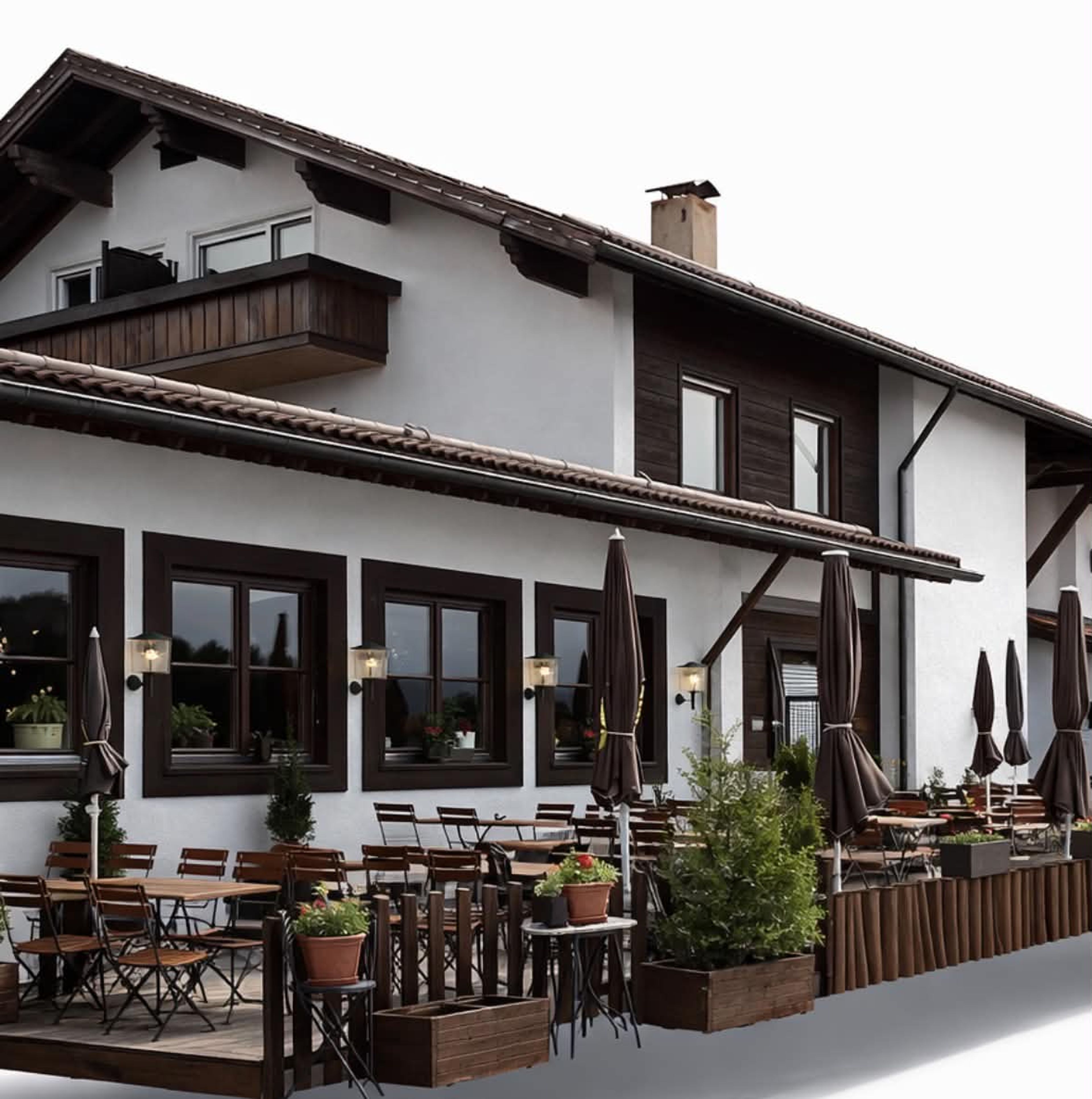 Das Alpstuben bei Dämmerung, mit beleuchteter Fassade und eingeklappten Sonnenschirmen auf der Terrasse