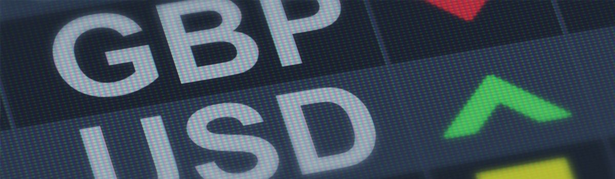 GBP & USD exchange rate board with red down and green up arrows. 
